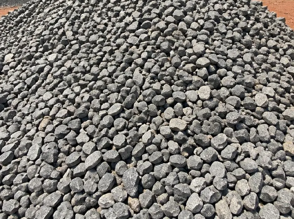 Heap of grey 3/4 inch crushed stone aggregate at a building materials yard